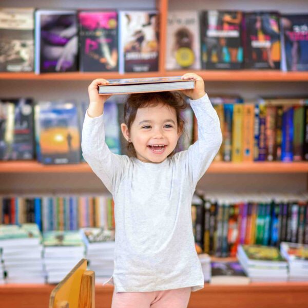 Girl-Celebrating-with-book-get-troup-reading.jpg